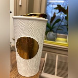 White and gold Starbucks travel mug